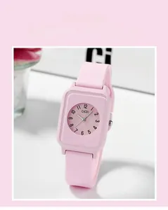 Detail view of pink square silicone watch with numeric dial and soft matte texture