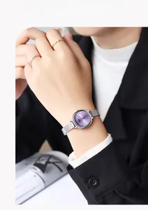 Minimalist purple dial watch with silver mesh strap and decorative gold rings