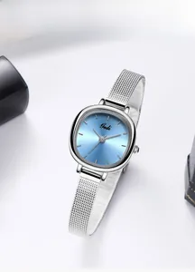 Detail of light blue sunray dial and silver mesh steel strap on a ladies watch