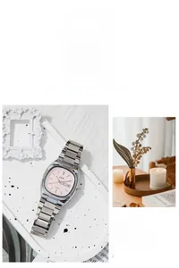 Close-up of pink oval dial with day-date window and silver steel chain strap watch
