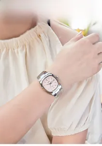 Detail of GEDI women's silver quartz watch with tonneau pink dial and metal strap