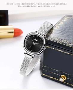 Detail of Gedi minimalist silver mesh strap watch with a black square dial near a jewelry box