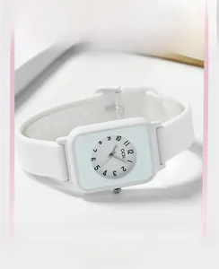 Detail of GEDI white silicone square watch showing minimalist dial and soft texture