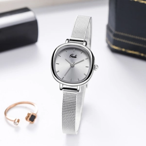 Elegant silver mesh strap quartz watch for women with rectangular dial and minimalist design