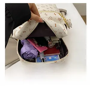 Interior view of large capacity cat print backpack showing tablet, umbrella and wallet