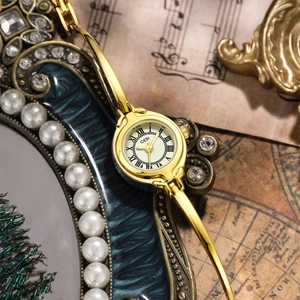 Vintage gold GEDI bangle watch for women featuring a small dial and Roman numerals