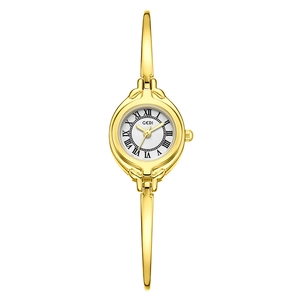 Elegant gold bracelet watch for women featuring a white Roman numeral dial and slim band
