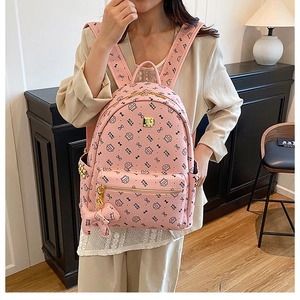 Pink PU leather backpack featuring cute cat prints and stylish side metal rivets