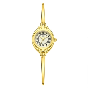 Elegant gold-tone bangle watch for women with vintage Roman numerals and white dial