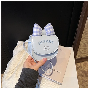 Detail of light blue cat embroidery and plaid bow on mini cartoon shoulder bag