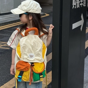 Kids color-block backpack with large capacity and vibrant canvas multi-pocket design