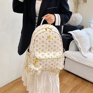 Chic beige cat-themed backpack with GICA IMAO print and cute puppy charm for travel
