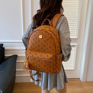 Women's cognac faux leather backpack with cat print, golden rivets and large capacity