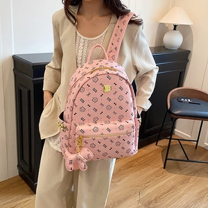 Pink cartoon cat print backpack for women with cute puppy charm and rivet details