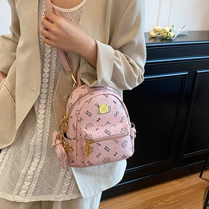 Pink mini leather backpack with cute cartoon prints and golden logo for girls