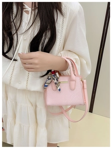 Pink faux snakeskin mini tote bag with decorative silk scarf handle and shoulder strap