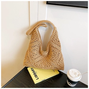 Detail of French crochet tote bag showing hollow-out knit pattern and fabric lining