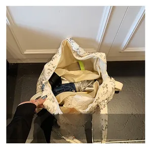 Top view of large capacity floral diaper bag showing spacious interior compartments