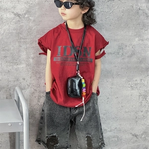Kids trendy street fashion set with red t-shirt, distressed denim shorts and mini bag