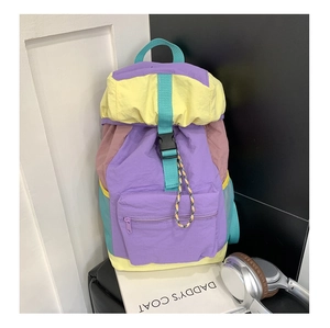 Detail of colorful multi-pocket travel backpack with adjustable buckles and mesh side pocket