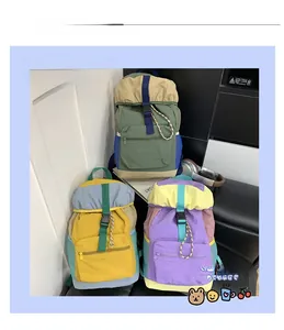 Detail display of stylish color-block kids backpacks with buckles and mesh side pockets
