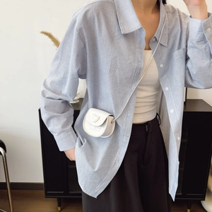 Minimalist white heart mini crossbody bag for kids featuring a glossy patent leather finish
