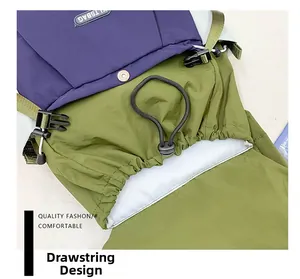 Detail of tear-resistant nylon backpack featuring purple-green colorblock and drawstring closure