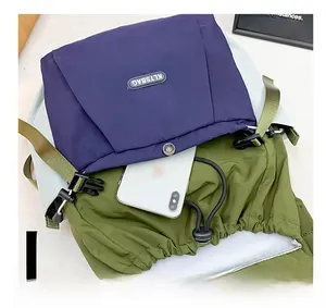 Detailed view of the nylon kids backpack front pocket showing smart storage space