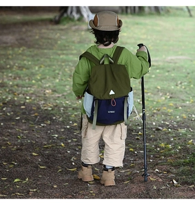 Close-up of kids outdoor backpack featuring olive green and navy blue nylon design