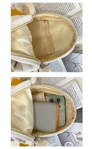 Detail of canvas shoulder bag showing inner compartment with phone and power bank storage