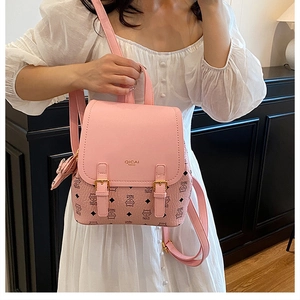 Detail of pink PU leather mini backpack featuring cute cat print and buckled flap closure