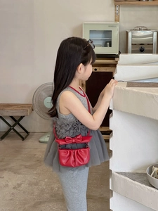Detailed view of red cloud-shaped girl's crossbody bag featuring a large decorative bow
