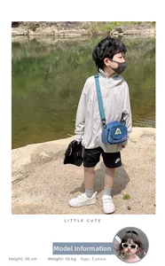 Blue children crossbody bag made of durable nylon featuring a mountain badge and flap