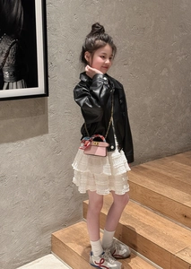 Pink chain crossbody bag for girls styled with a silk scarf on leather jacket outfit