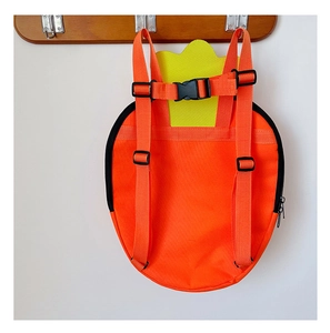 Detail of adjustable orange straps and black chest buckle on carrot kids backpack