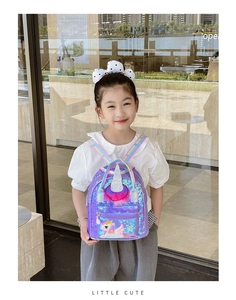 Close-up of girls purple sequin unicorn backpack with colorful rainbow shoulder straps