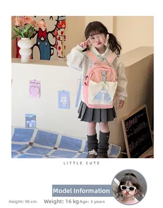 Pink and beige school backpack for kids featuring large front pockets and letter print
