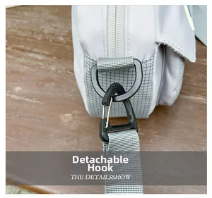 Detail of detachable buckle on casual grey nylon shoulder bag for kids