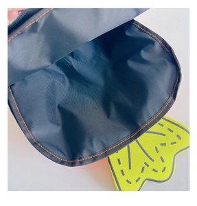 Detail showing spacious interior lining and orange stitching of carrot tennis backpack