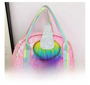Detail of pink sequin unicorn backpack showing rainbow straps and fluffy colorful plush