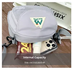 Detail view of the compact crossbody bag showing its internal capacity and compartments