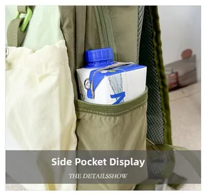 Detail view of the tricolor backpack side pocket with an elasticated opening for bottles