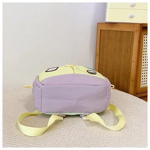 Detail view of the colorful拼接 backpack base with adjustable yellow shoulder straps
