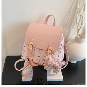 Close-up of pink backpack with litchi grain texture and cute cat printed pattern