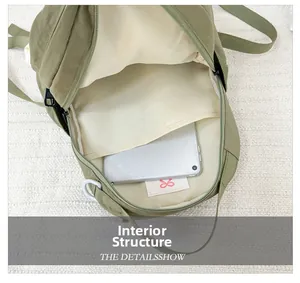 Interior view of kids nylon backpack showing spacious compartment with a tablet and logo
