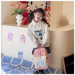 Detail of pink and grey contrast school backpack with comfortable shoulder straps on a child