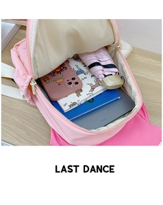 Detailed interior of a pink school bag showing large capacity and organized storage space