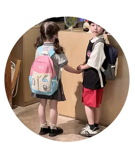 Kids color-block backpack with Lucky patch shown in pink and navy blue versions