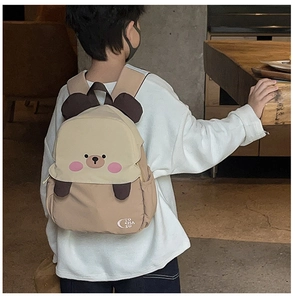 Close-up of the cute 3D bear ears and waterproof nylon fabric on the kids backpack