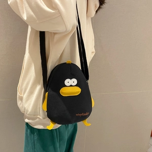 Cute cartoon penguin canvas shoulder bag with 3D yellow beak and yellow feet accents